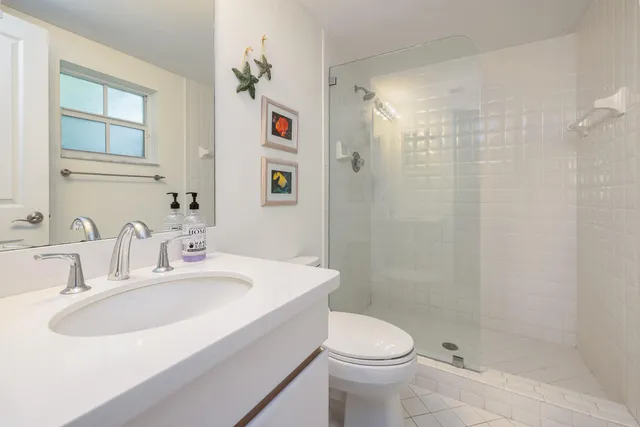a dining room with furniture and a floor to ceiling window