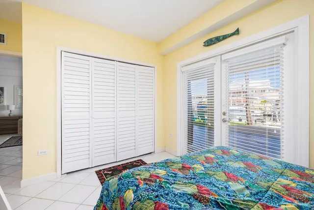 a living room with furniture and a open kitchen view