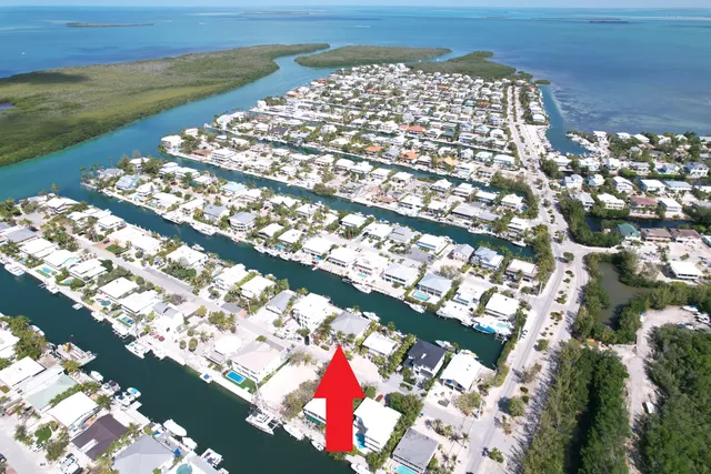 a view of multiple houses with a street
