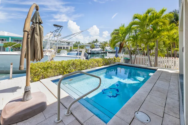 a view of a backyard with sitting area