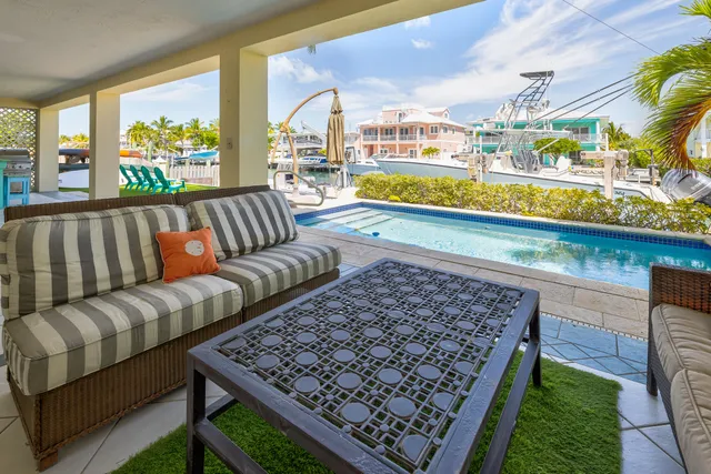 a view of a swimming pool with a patio