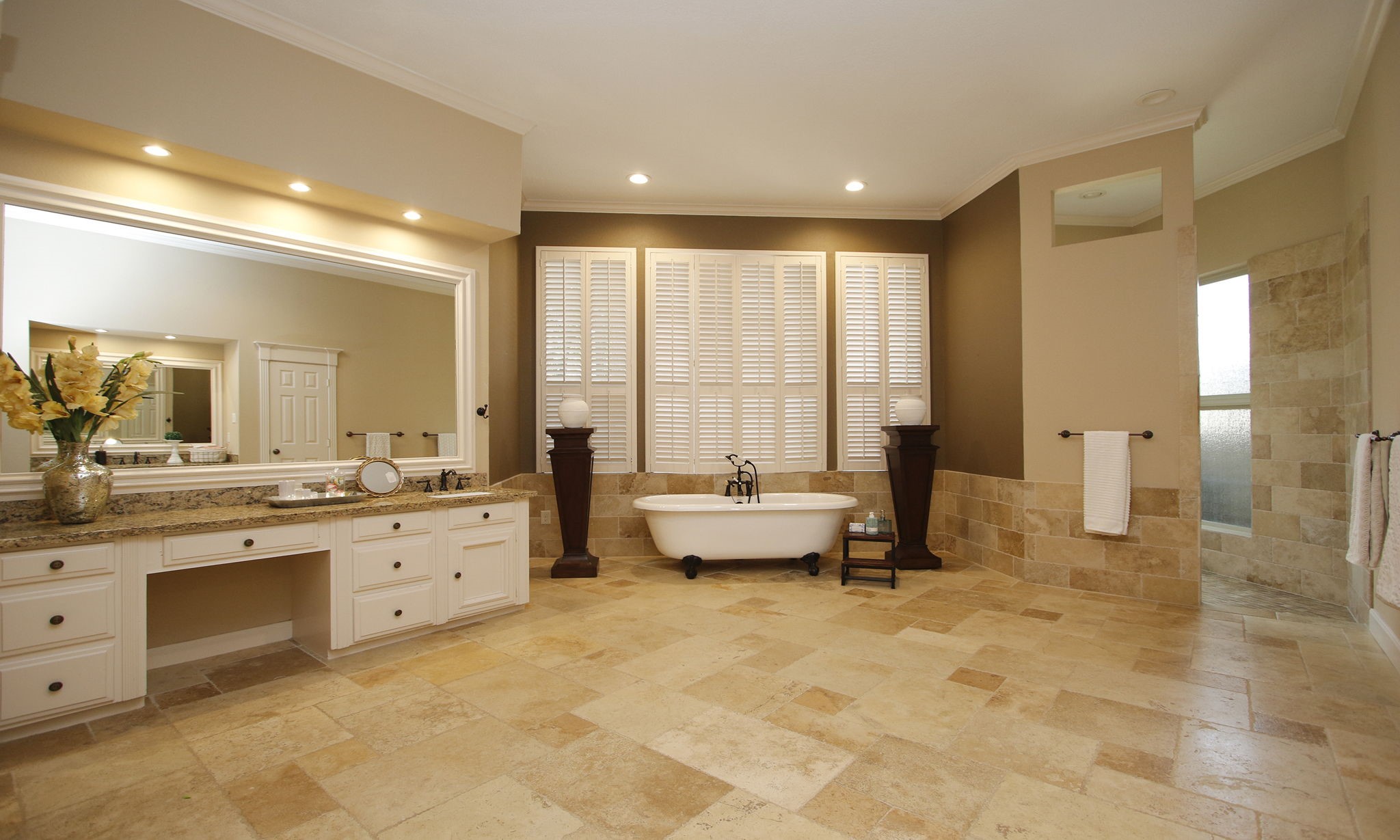 15923 Harwick Drive Spring, TX 77379 - Photo 15 of 50 Spa days are now at home! This luxurious primary bath features dual vanities, a freestanding soaking tub, an oversized walk-in shower, and timeless stone finishes throughout.