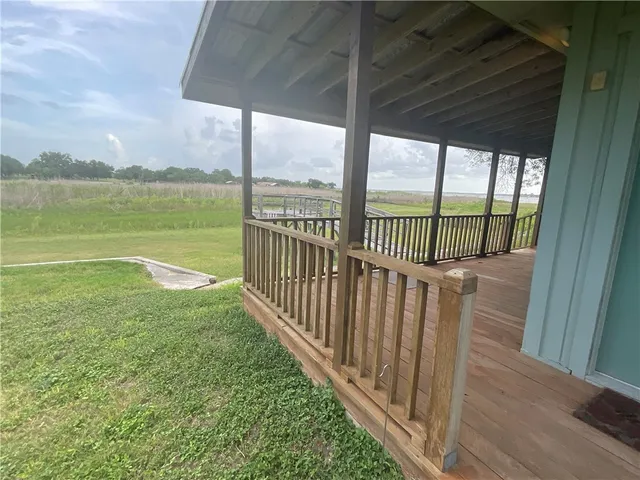 a view of a backyard with lake and mountain view