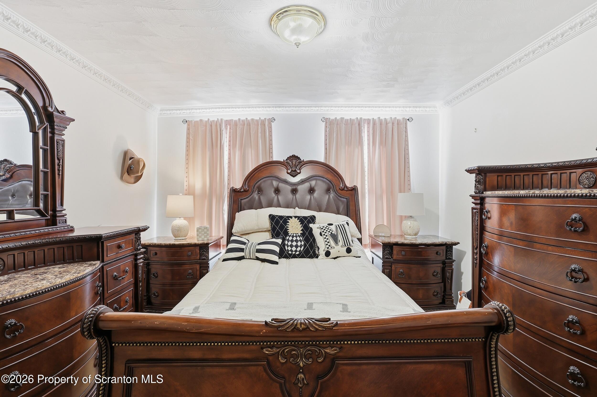 143 Old Boston Road Pittston, PA 18640 - Photo 29 of 61 a bed sitting in a bedroom next to a window