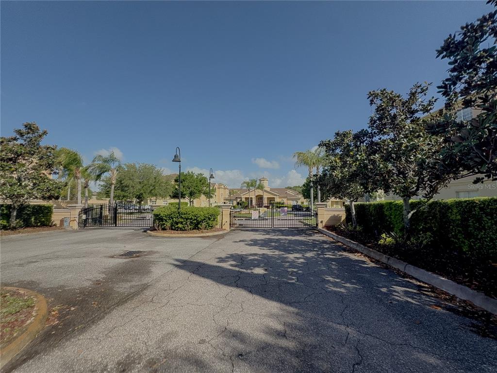 204 Terrace Ridge Circle, Unit 204 Davenport, FL 33896 - Photo 17 of 17 a view of a street with a trees