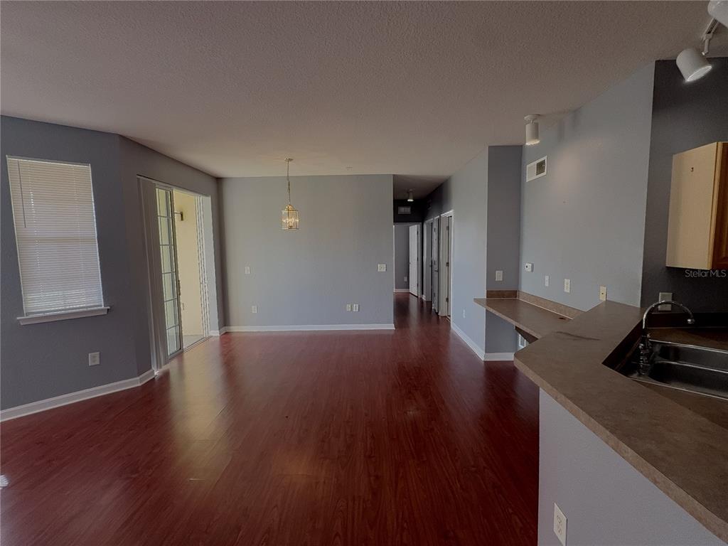 204 Terrace Ridge Circle, Unit 204 Davenport, FL 33896 - Photo 4 of 17 a view of a livingroom with wooden floor