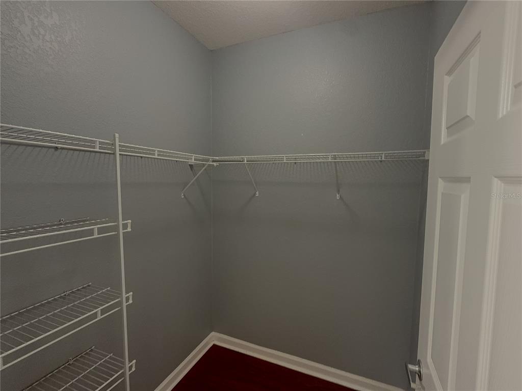 204 Terrace Ridge Circle, Unit 204 Davenport, FL 33896 - Photo 6 of 17 a view of a room with racks on the wall