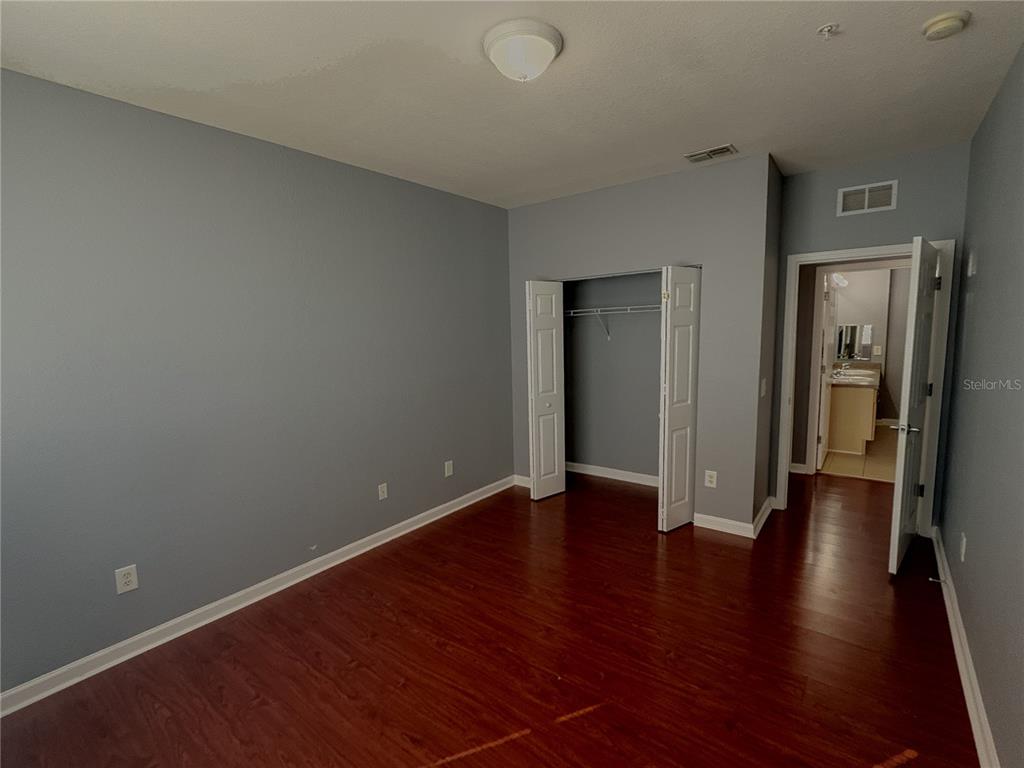 204 Terrace Ridge Circle, Unit 204 Davenport, FL 33896 - Photo 8 of 17 wooden floor in an empty room