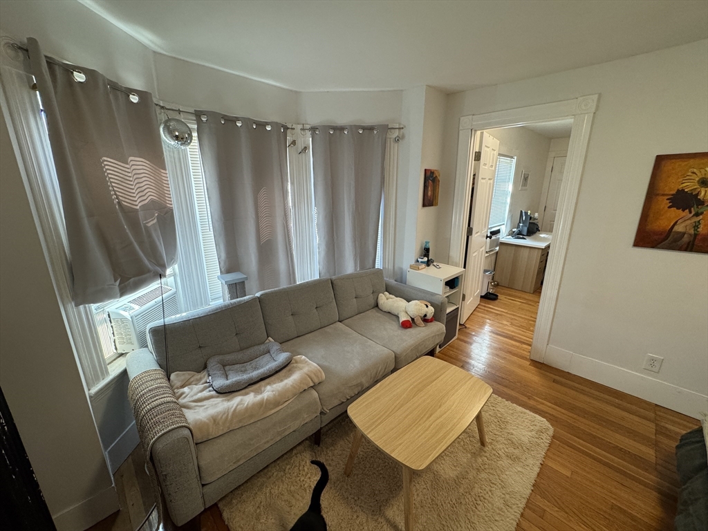 5 Blake Street, Unit 4 Cambridge, MA 02140 - Photo 1 of 14 a living room with furniture and a wooden floor