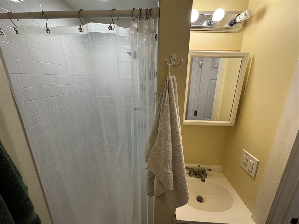 5 Blake Street, Unit 4 Cambridge, MA 02140 - Photo 13 of 14 a bathroom with a sink toilet and shower