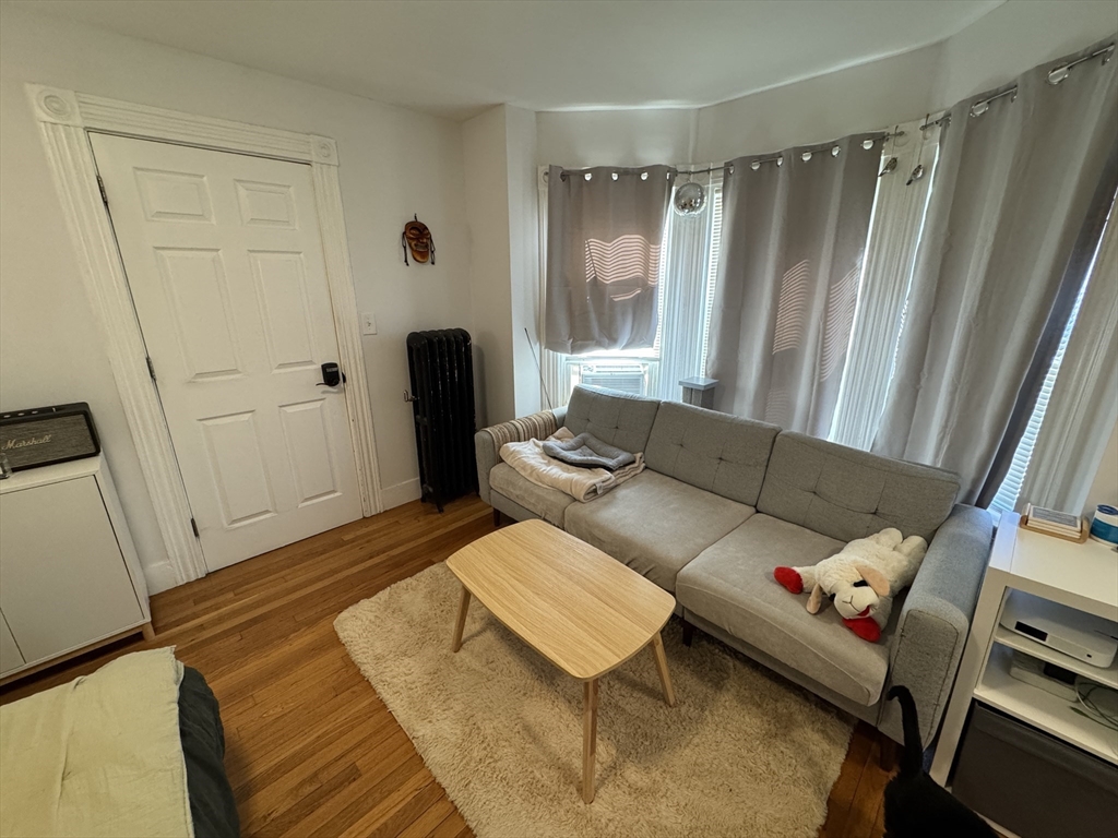 5 Blake Street, Unit 4 Cambridge, MA 02140 - Photo 2 of 14 a living room with furniture and a window