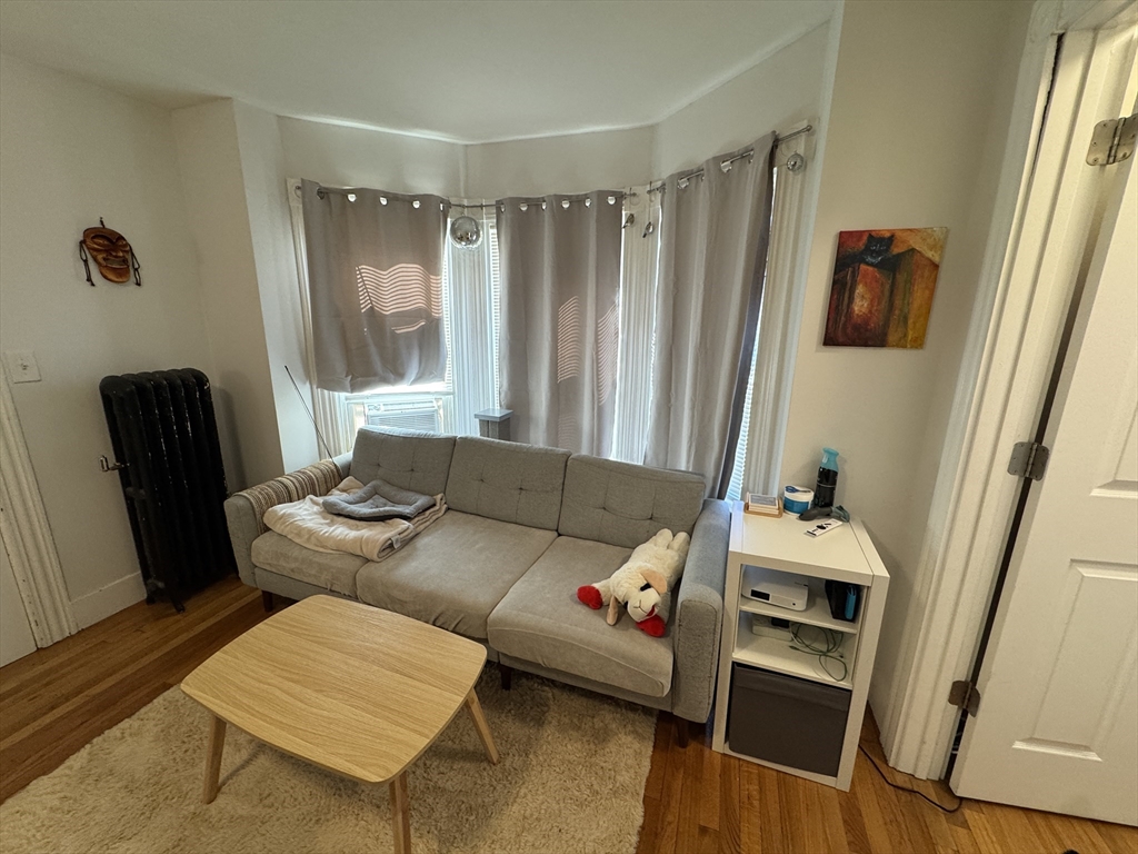 5 Blake Street, Unit 4 Cambridge, MA 02140 - Photo 5 of 14 a living room with furniture and a window