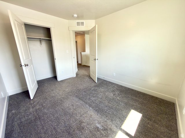 1823 South Longview Road Santaquin, UT 84655 - Photo 34 of 69 Room featuring light-colored walls, gray textured carpeting, and white baseboards