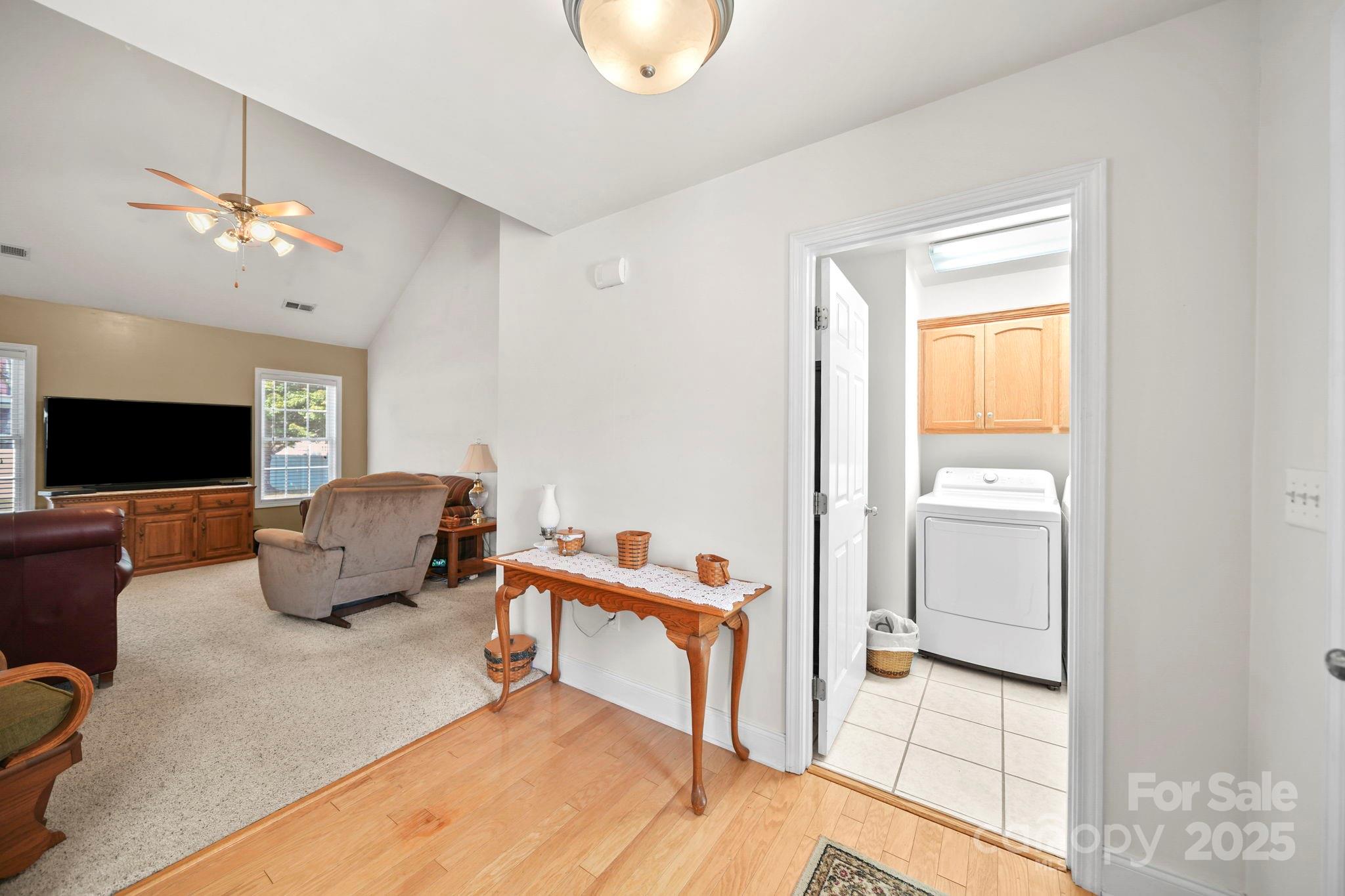 209 Lagoda Drive Locust, NC 28097 - Photo 11 of 43 a living room with furniture and a flat screen tv