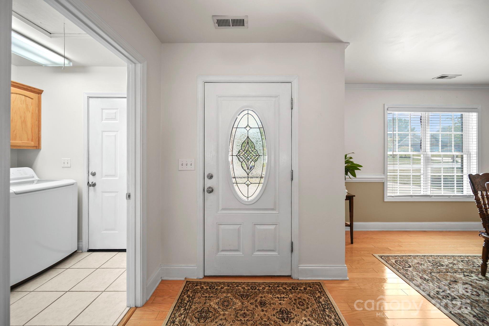 209 Lagoda Drive Locust, NC 28097 - Photo 13 of 43 a view of an entryway with a rug
