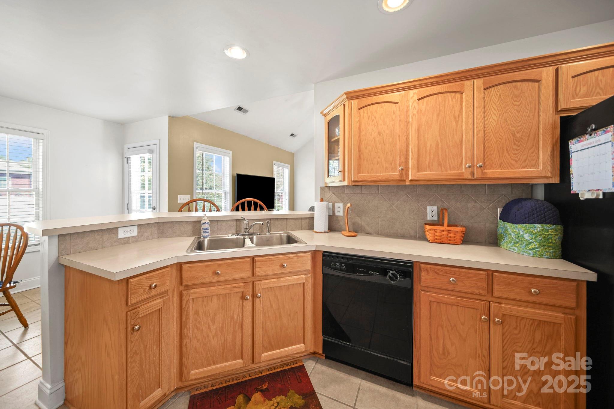 209 Lagoda Drive Locust, NC 28097 - Photo 18 of 43 a kitchen with stainless steel appliances granite countertop a sink stove and cabinets