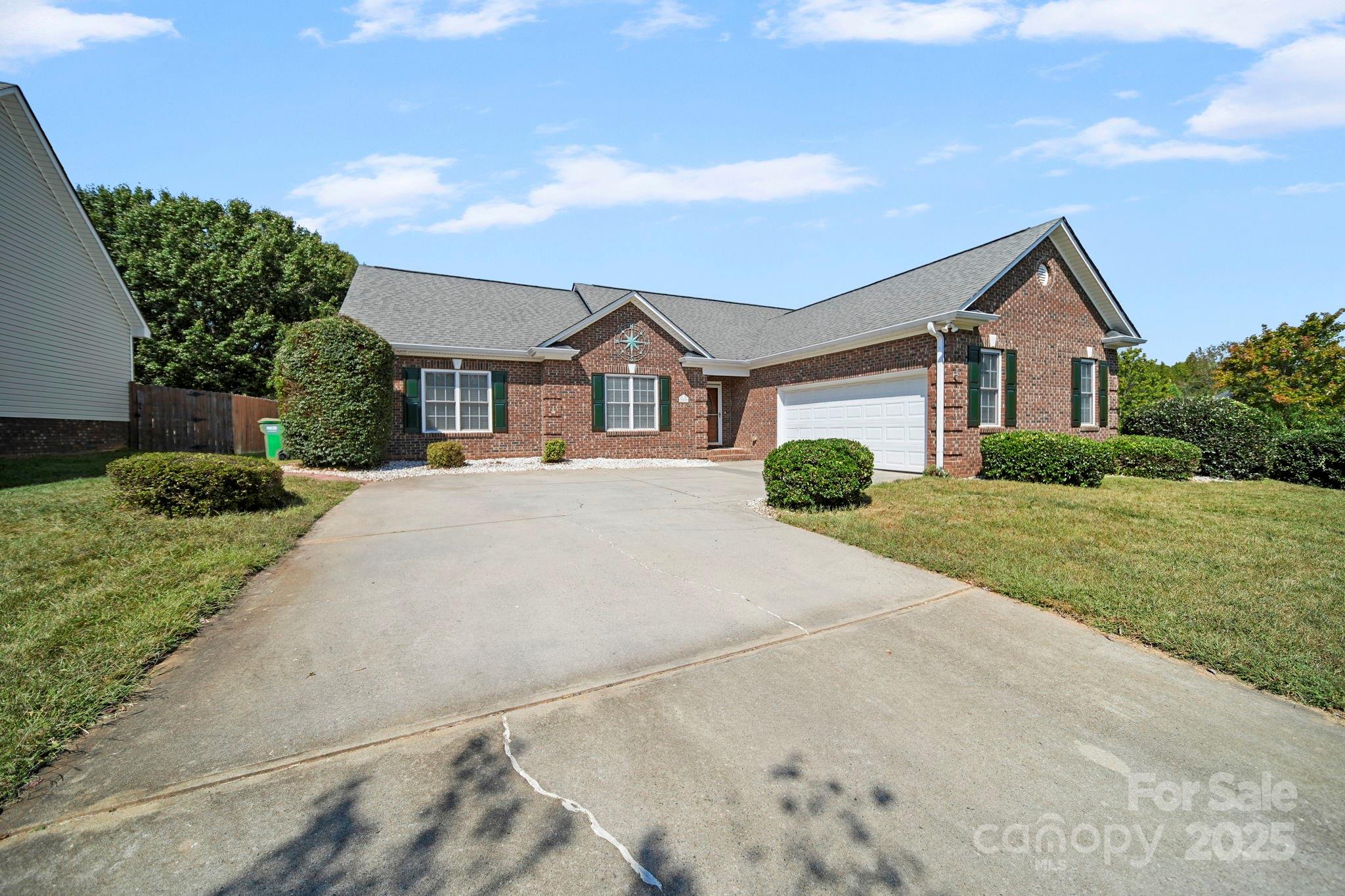 209 Lagoda Drive Locust, NC 28097 - Photo 2 of 43 a front view of a house with a yard