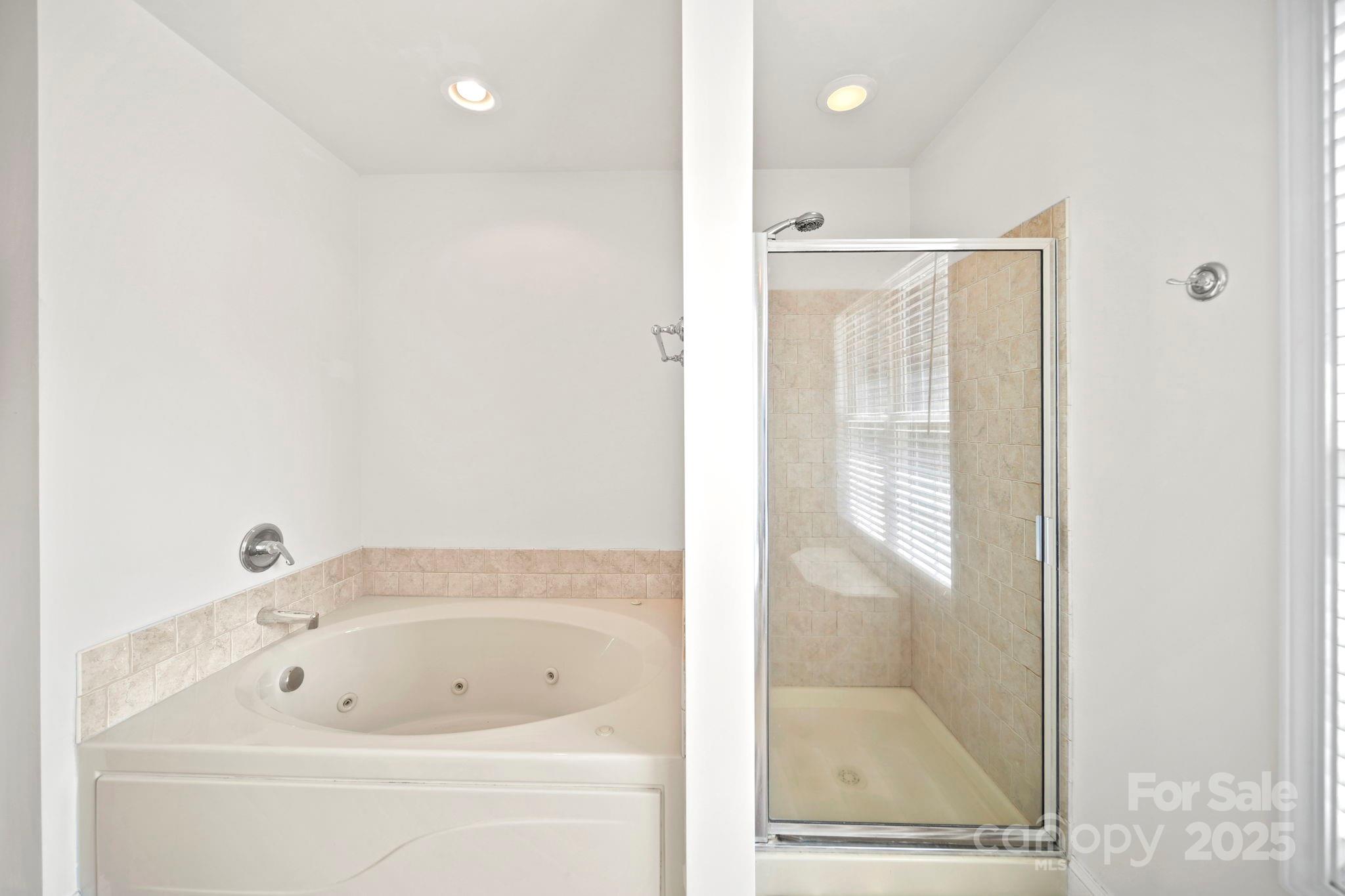 209 Lagoda Drive Locust, NC 28097 - Photo 26 of 43 a bathroom with a bathtub and a shower
