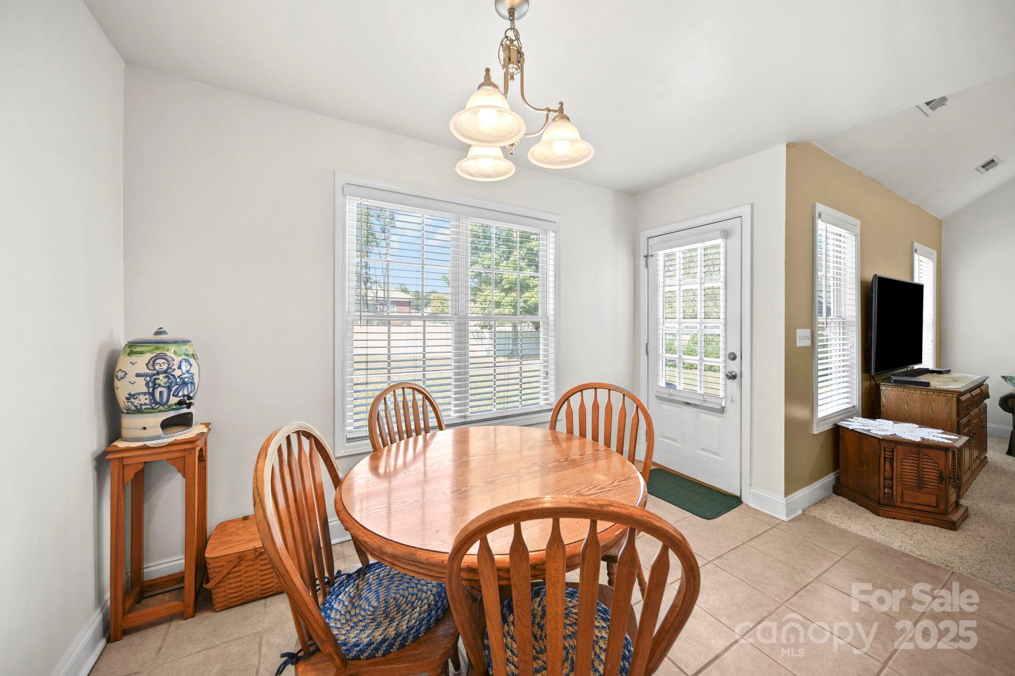 209 Lagoda Drive Locust, NC 28097 - Photo 29 of 43 a view of a dining room with furniture window and wooden floor