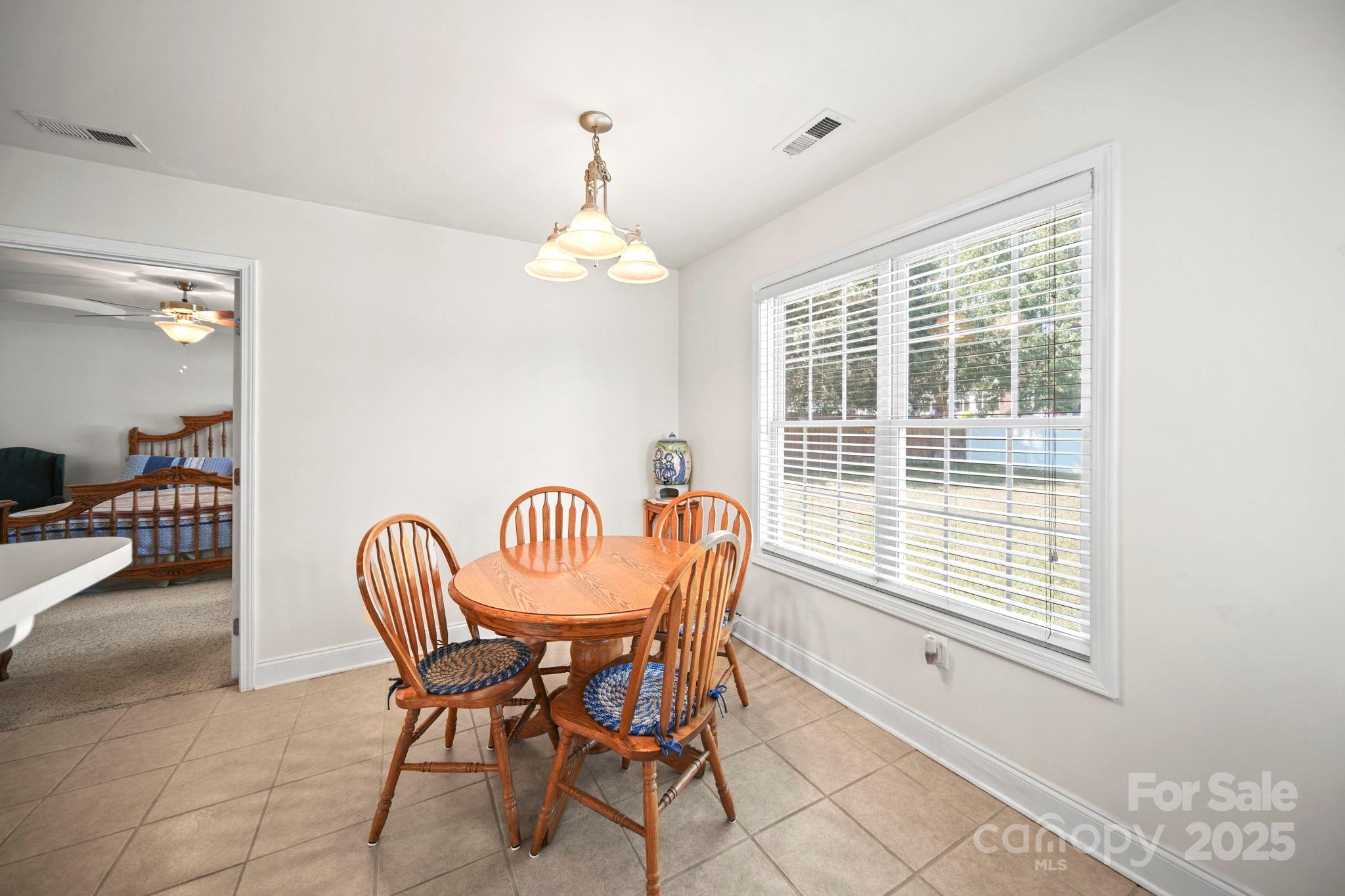 209 Lagoda Drive Locust, NC 28097 - Photo 30 of 43 a view of a dining room with furniture window and outside view
