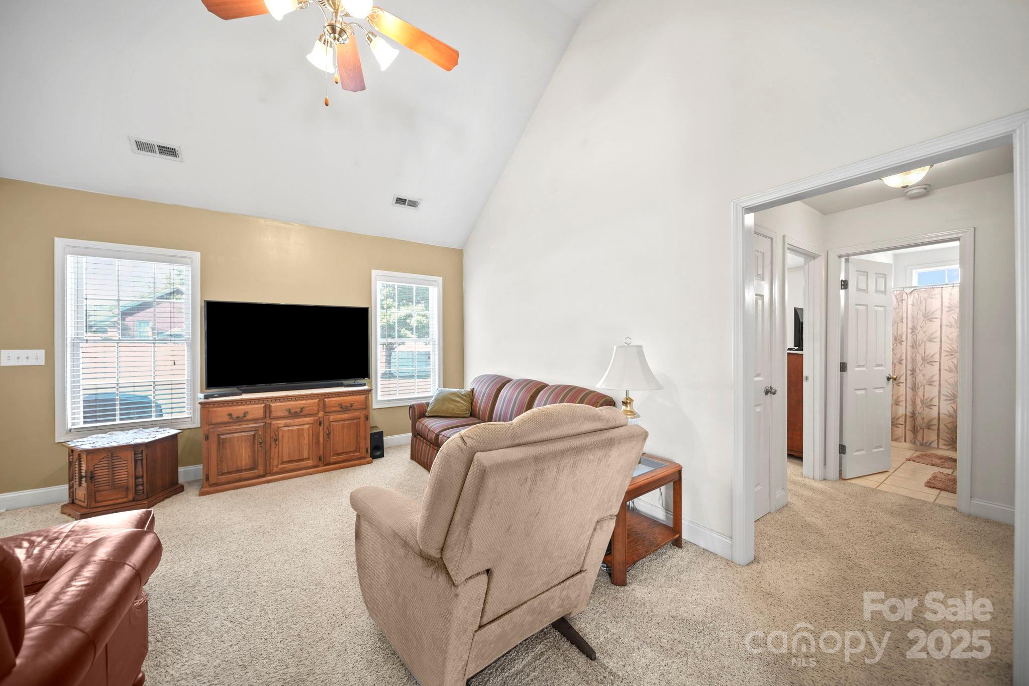 209 Lagoda Drive Locust, NC 28097 - Photo 33 of 43 a living room with furniture and a flat screen tv