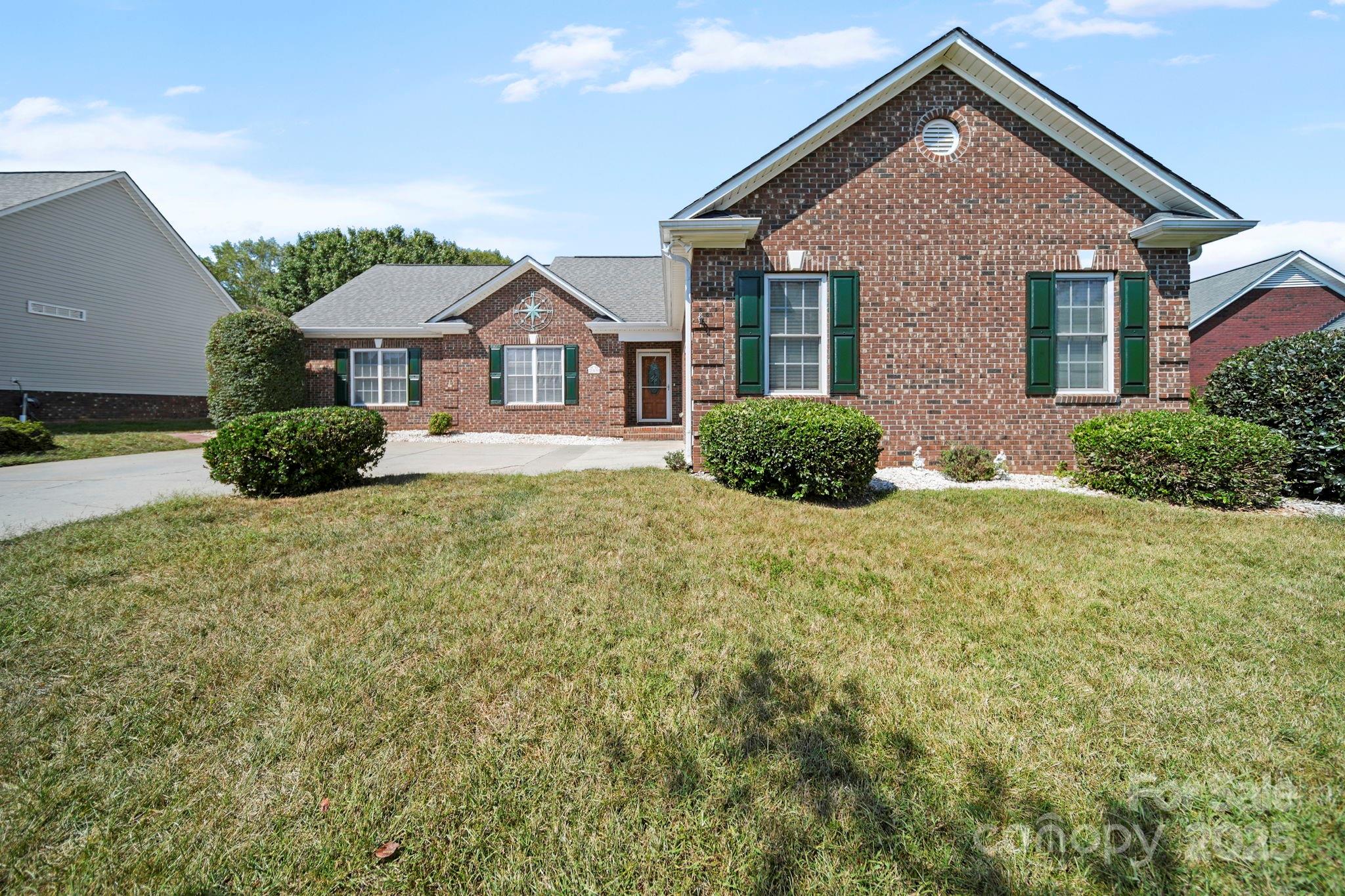 209 Lagoda Drive Locust, NC 28097 - Photo 4 of 43 a front view of a house with a yard