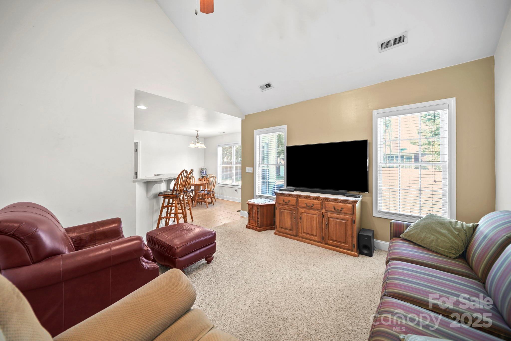 209 Lagoda Drive Locust, NC 28097 - Photo 41 of 43 a living room with furniture and a flat screen tv