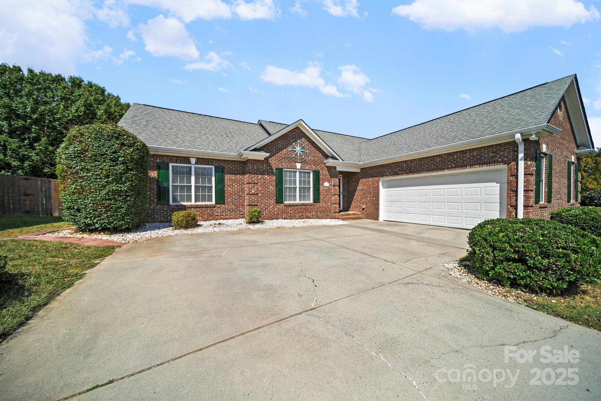 209 Lagoda Drive Locust, NC 28097 - Photo 6 of 43 a front view of a house with a yard and garage