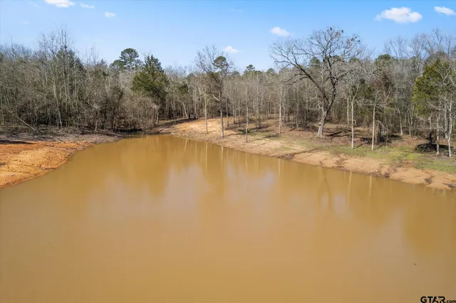 a view of a swimming pool with an outdoor space and seating area