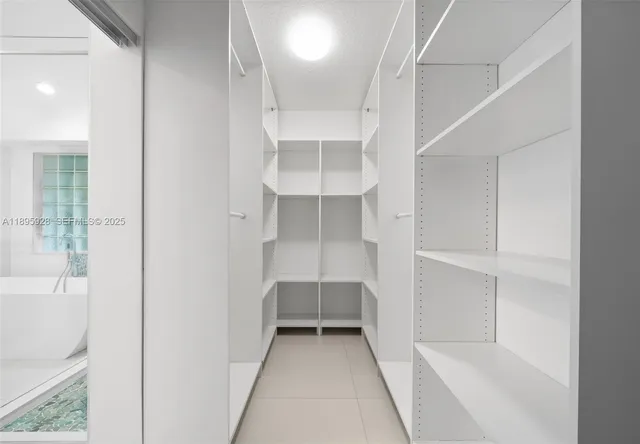 a view of an empty walk in closet