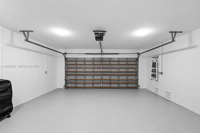 a view of room that has a car parked in it