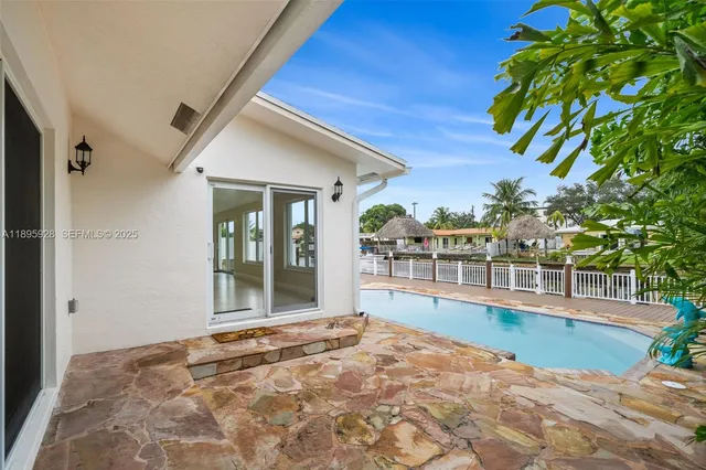 a view of a balcony with lake view and a floor to ceiling window