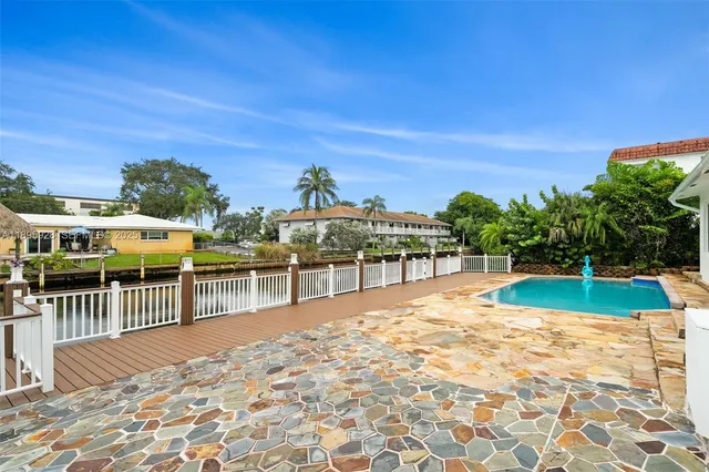 a view of a swimming pool with a patio