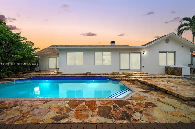 a view of a house with swimming pool