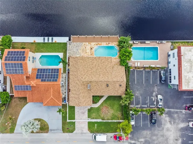 an aerial view of a house with a garden