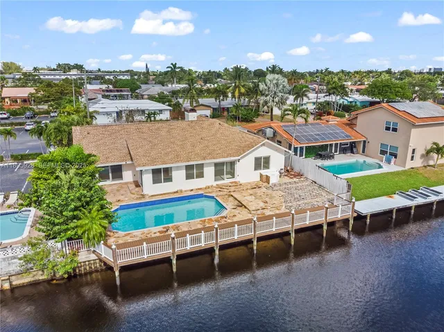 a aerial view of a house with a table and chairs
