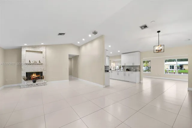 a view of a living room and kitchen with furniture