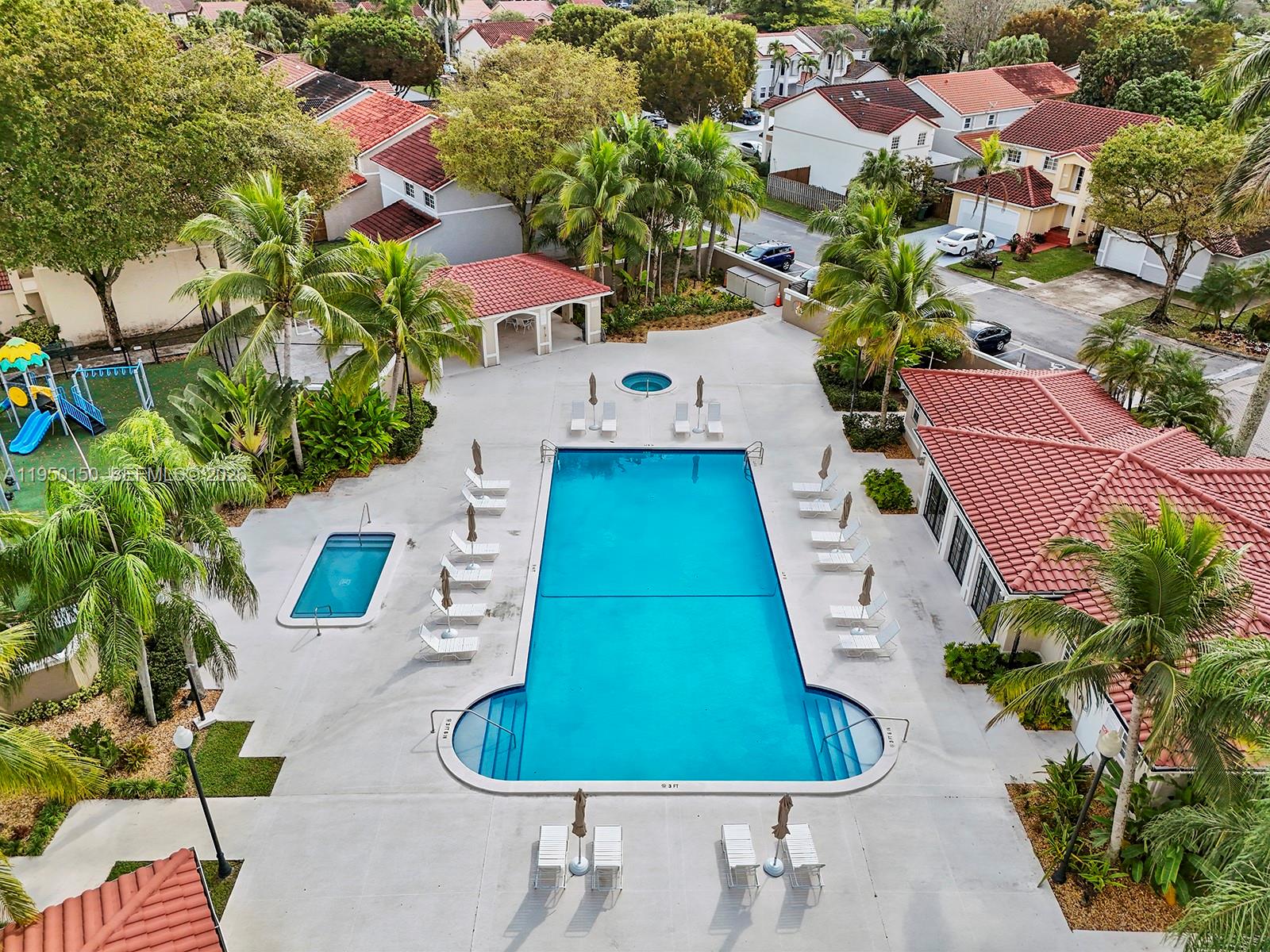 13821 Southwest 102nd Terrace Miami, FL 33186 - Photo 21 of 24 a aerial view of a house with swimming pool and garden