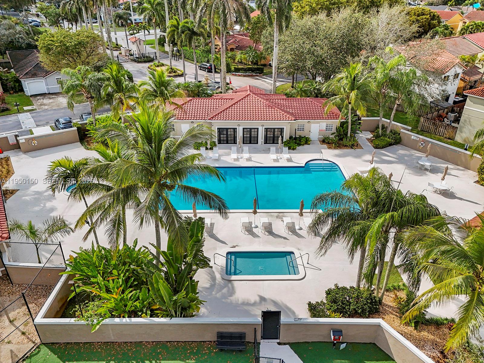 13821 Southwest 102nd Terrace Miami, FL 33186 - Photo 22 of 24 an outdoor space with plants and umbrella