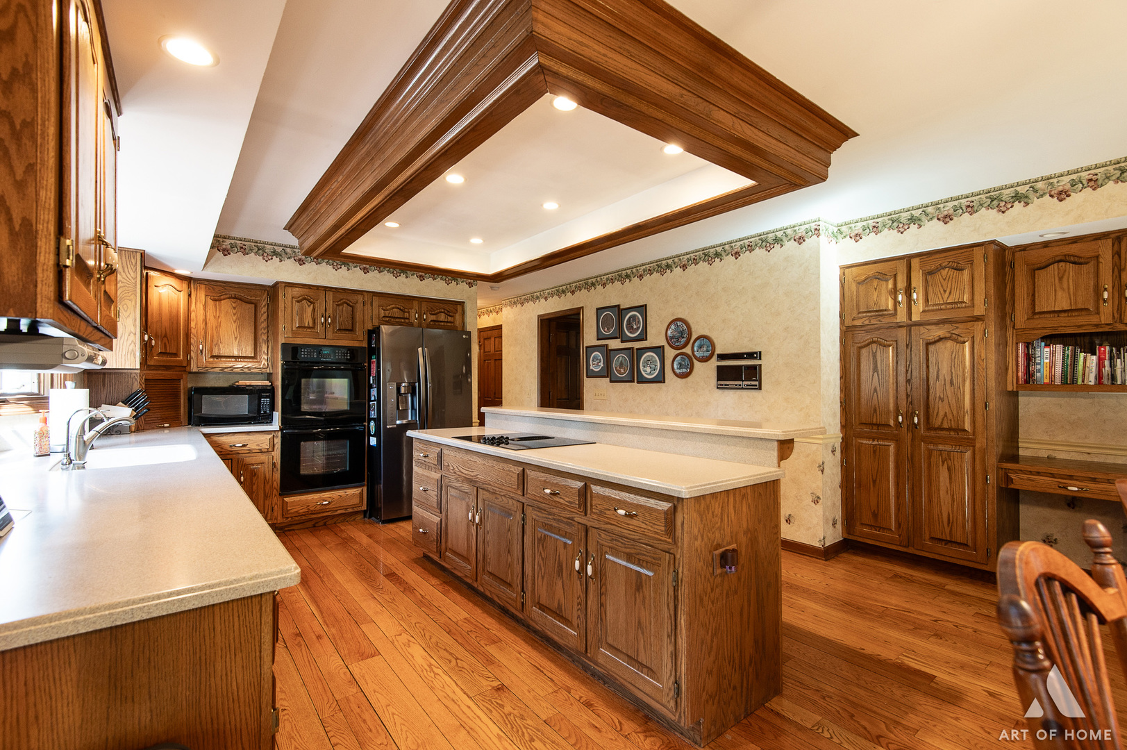 3112 Turnberry Road St. Charles, IL 60174 - Photo 18 of 77 a large kitchen with stainless steel appliances granite countertop a large stove a sink dishwasher and a refrigerator with wooden floor