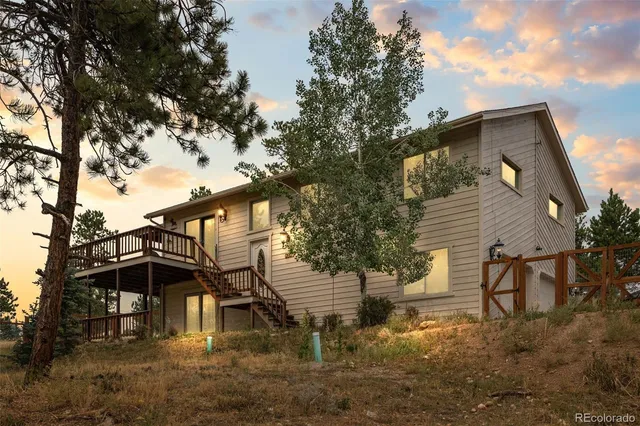 a kitchen with a table chairs microwave and cabinets