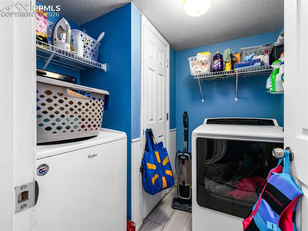 5044 Landmark Road Pueblo, CO 81008 - Photo 12 of 25 a utility room with dryer and washer