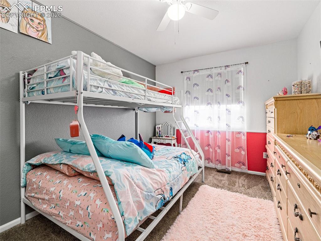 5044 Landmark Road Pueblo, CO 81008 - Photo 15 of 25 a bedroom with bed and a window