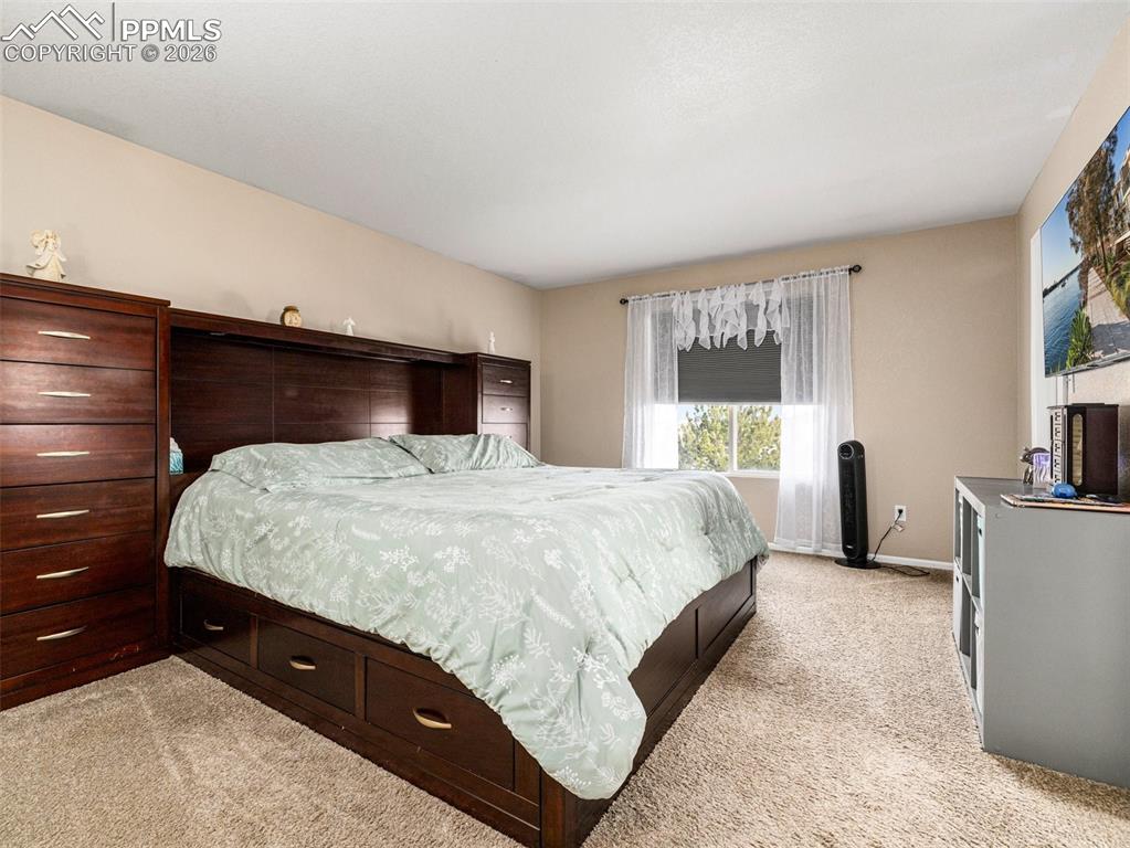 5044 Landmark Road Pueblo, CO 81008 - Photo 18 of 25 a bedroom with a bed and a window