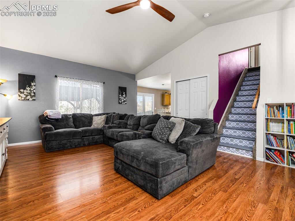 5044 Landmark Road Pueblo, CO 81008 - Photo 3 of 25 a living room with furniture and a book shelf