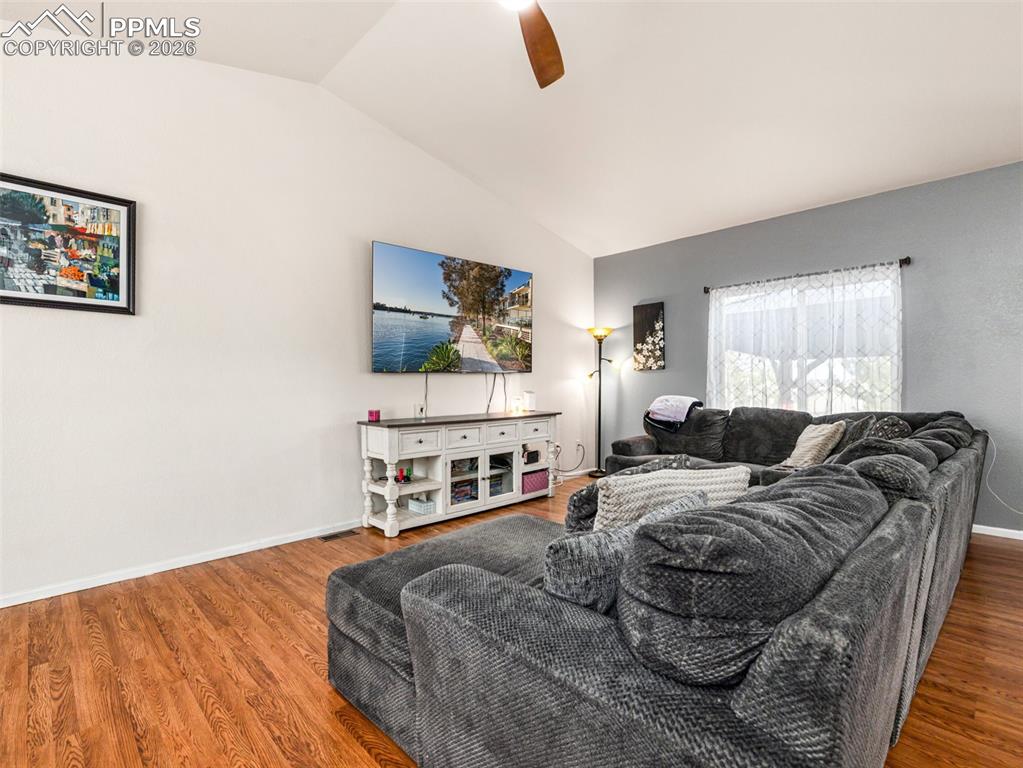 5044 Landmark Road Pueblo, CO 81008 - Photo 4 of 25 a bedroom with a bed and a flat screen tv