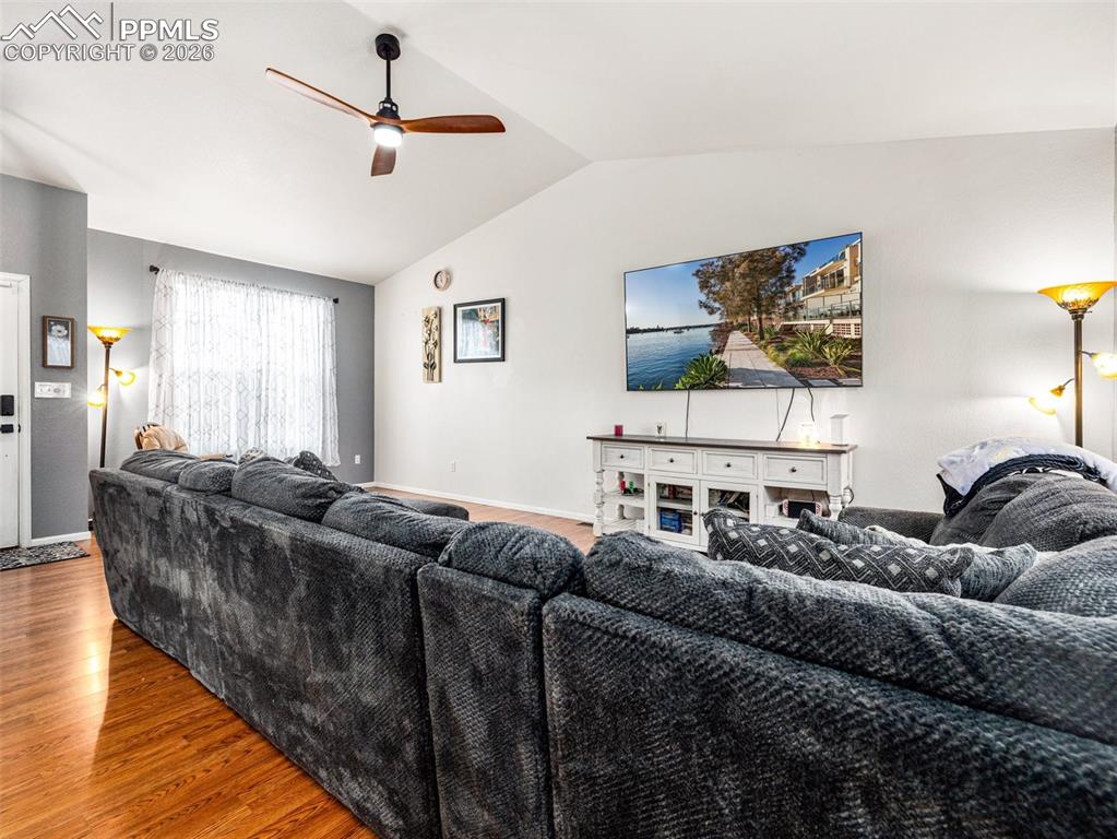 5044 Landmark Road Pueblo, CO 81008 - Photo 5 of 25 a living room with furniture and a flat screen tv