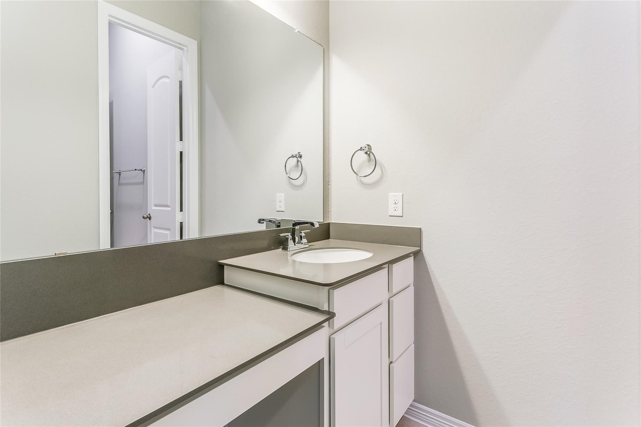 4227 Carol Ridge Drive Sugar Land, TX 77479 - Photo 27 of 35 a bathroom with a sink and a mirror