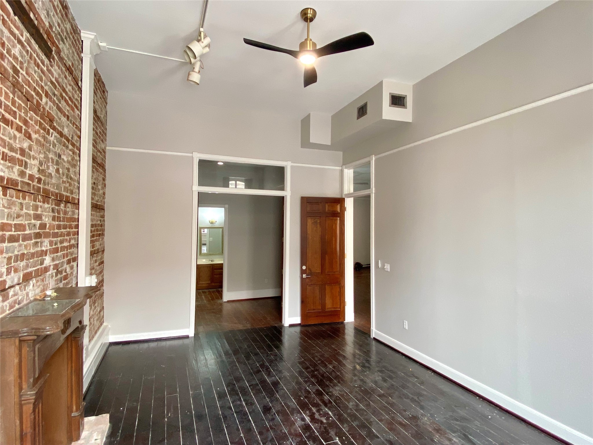 2319 The Strand, Unit 2A Galveston, TX 77550 - Photo 13 of 32 wooden floor in an empty room with a window