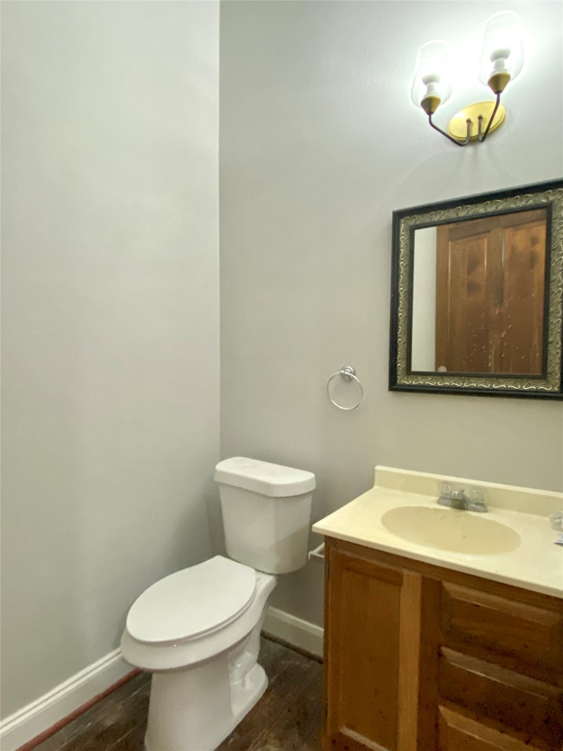 2319 The Strand, Unit 2A Galveston, TX 77550 - Photo 16 of 32 a bathroom with a toilet sink and mirror